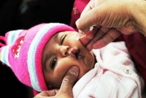 An infant in Karachi, Pakistan receives polio drops in a recent vaccination campaign.